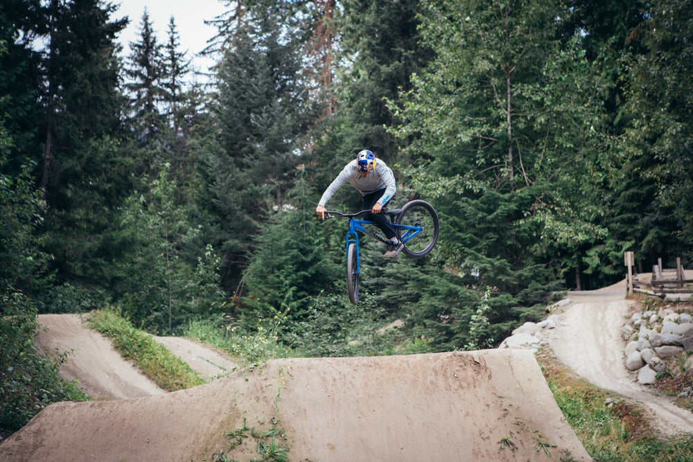 Matt Jones rides his Marin Alcatraz in a stylish manner through some dirt jumps