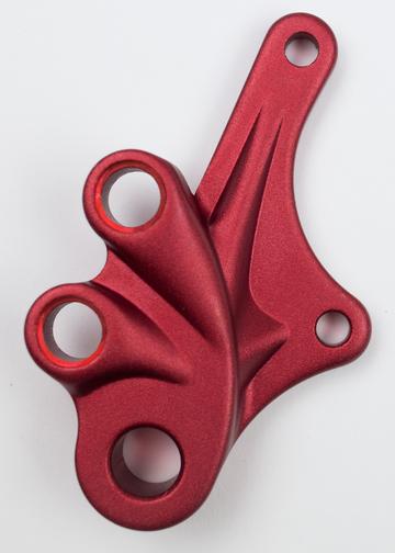 A red Marin Bikes rear dropout and disc brake mount