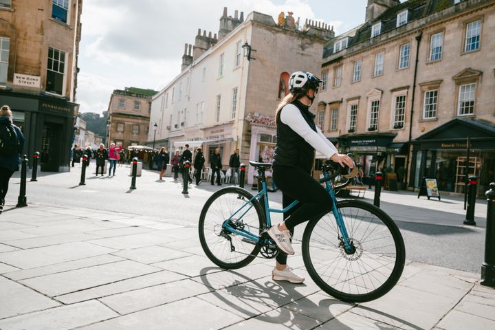 Woman riding in Bath city centre