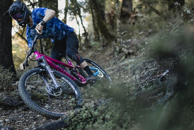 Man rides a rough woodland trail