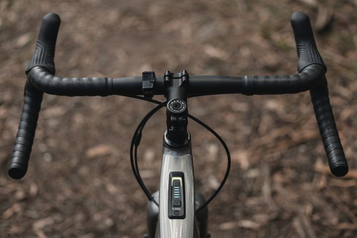 Close-up of a bicycle handlebar with blurred background