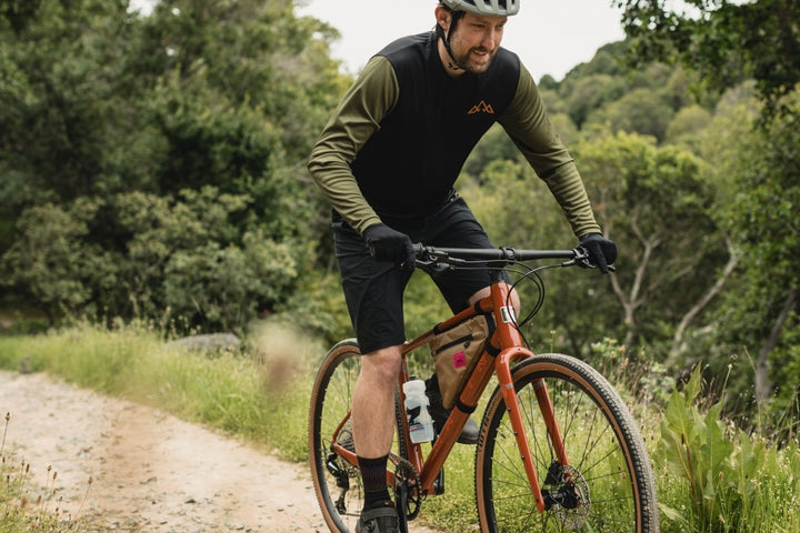 Man rides along a gravel track
