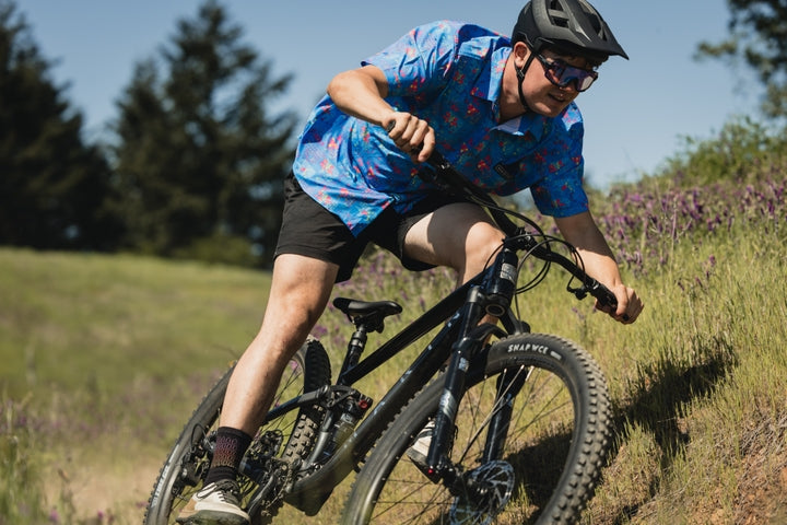 Man rides along a dusty trail