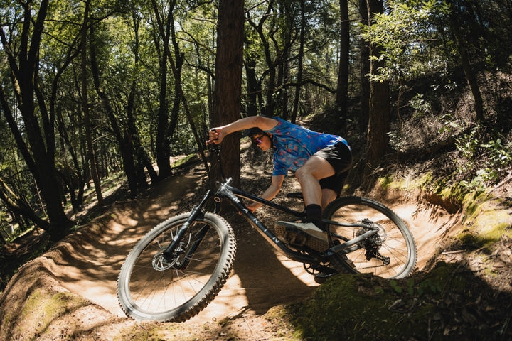 Man riding a bike on a woodland trail