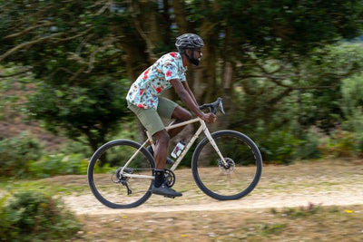 Man rides along a gravel track