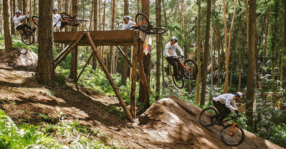 Man on bike slides over wooden platform - photo from red bull's frame of mind